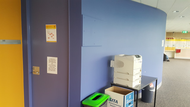 308 Student study area beside computer lab and printer.