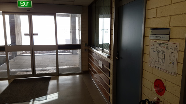 Adjunct staff/visitors office beside entrance.