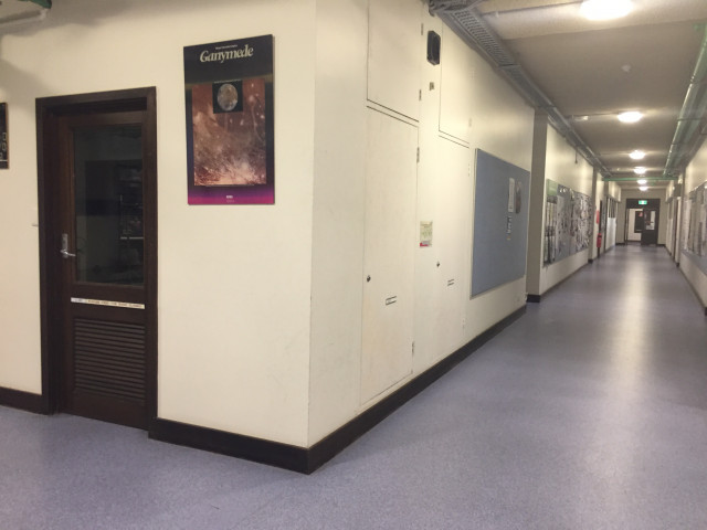 Around the corner and down the hall from physics entrance