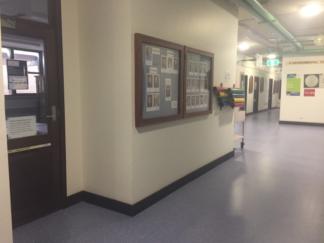 At the end of the corridor on the left