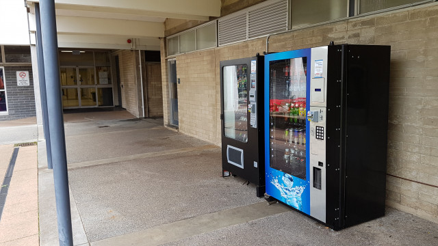 Cold beverage vending machine outside entrance of Physical Sciences.