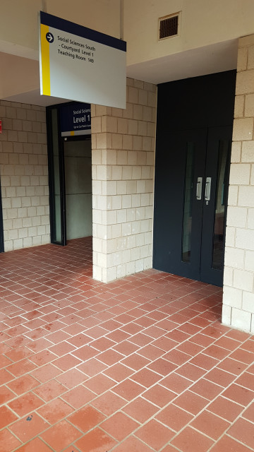 Courtyard door leading to lecture theatre 149.