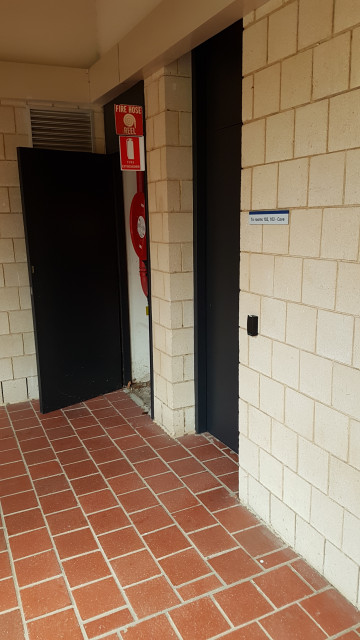 Courtyard door leading to rooms 102 and 103