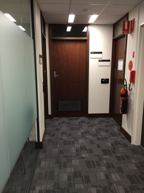Door at the end of the hall, between media labs 4 and 5.