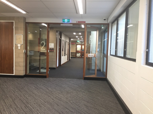 Glass doors leading to the Sir Walter Murdoch historical walk