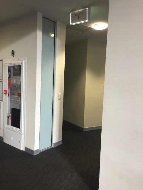 Down the hall and on the left