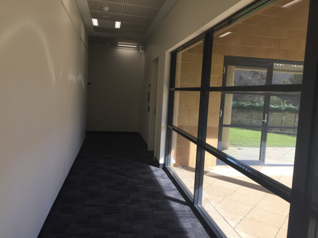 Down the hall and on the right.