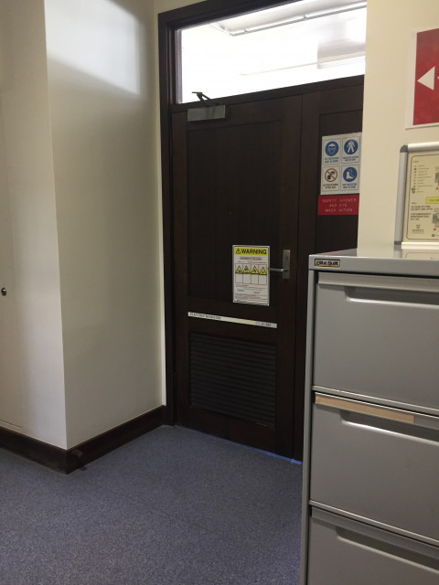 Entrance 2, next to the printer