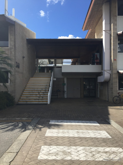 Entrance to level 1 located to the right of the staircase to level 2