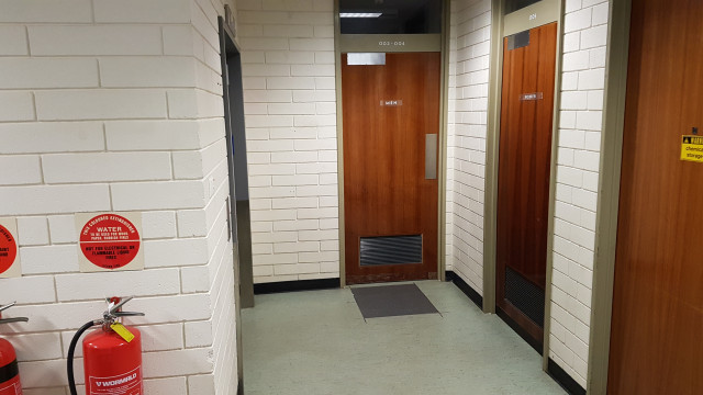 Female toilet door around the corner.