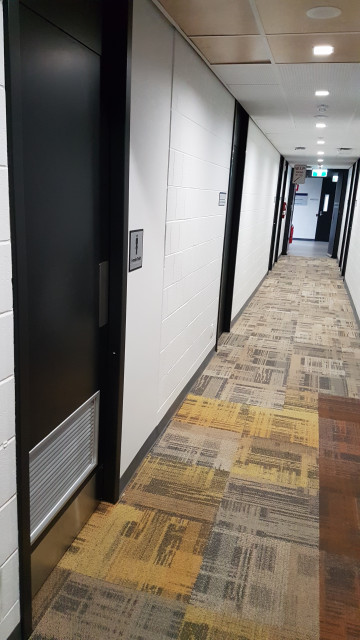 Female toilet looking down the west hallway