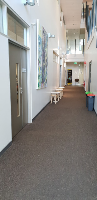 Female toilets are to the left at the end of this corridor
