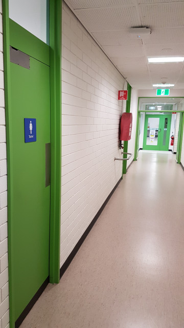 Female toilets facing the corner of the building.