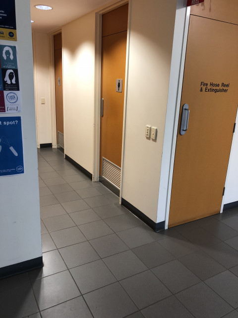 First door on right in corridor, view from lift entrance