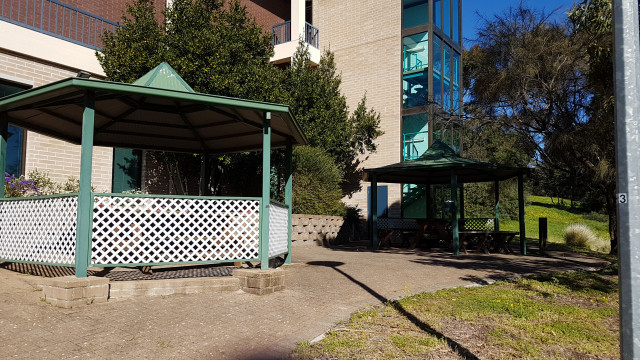 Flinders living ballroom smoking area from medical centre direction.