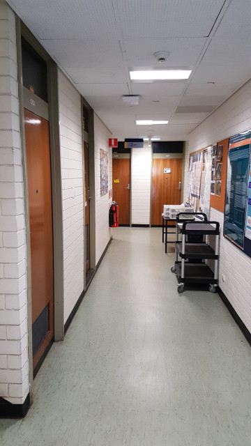 Hidden toilets around the corner at the end of this corridor.