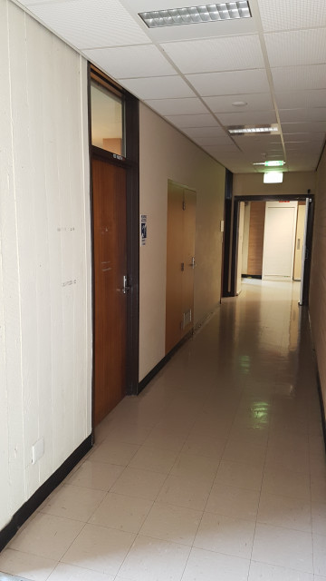 Lecture theatre 102 left entrance by elevator