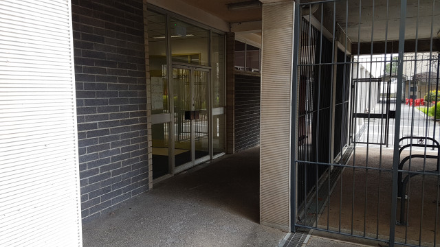 Level 0 entrance under anchor court stairs to level 1.