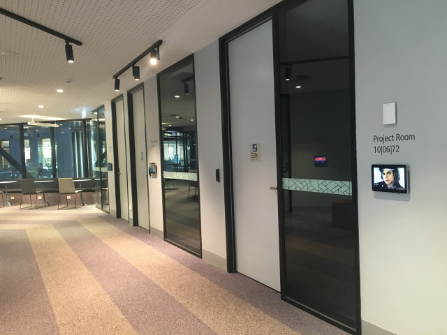Located in a line of project rooms to the left of the escalators if you have come up from level 5.
