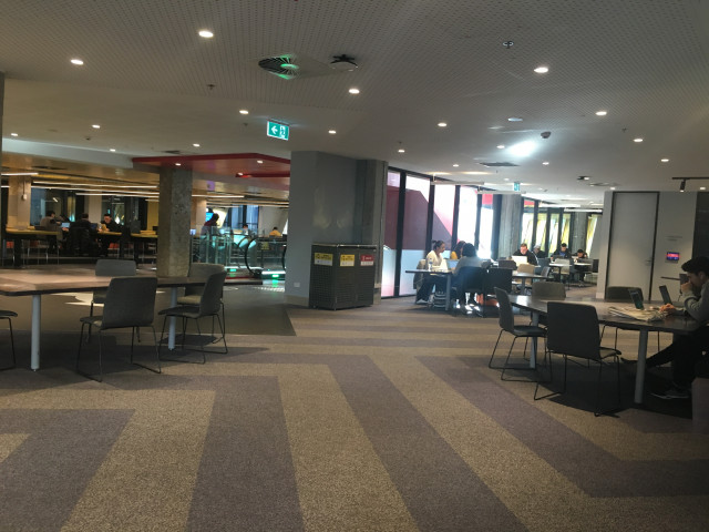 Located to the left of the escalators if you come up from level 5. There are multiple places in a circle around the meeting rooms.