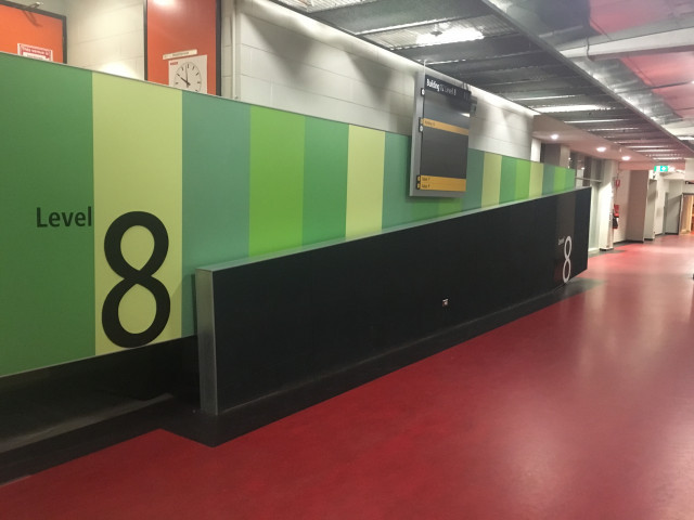Look for the green wall.