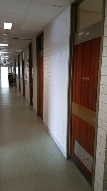 Male toilet from the northwest corner of the building.