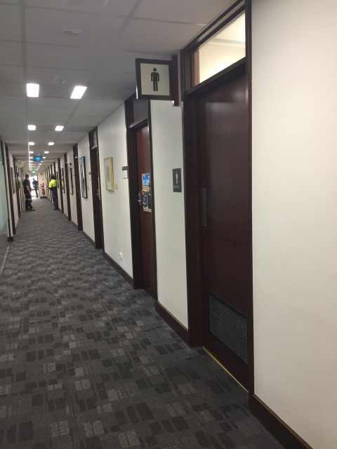 Male toilet located next to female toilet