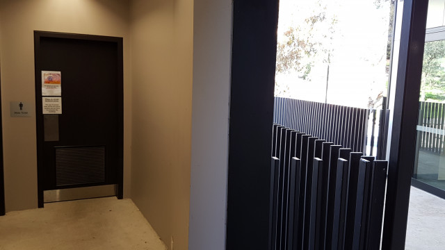 Male toilets by the road entrance of the building.