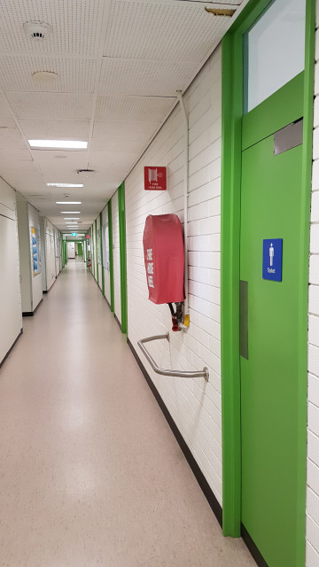 Male toilets from the corner of the building.