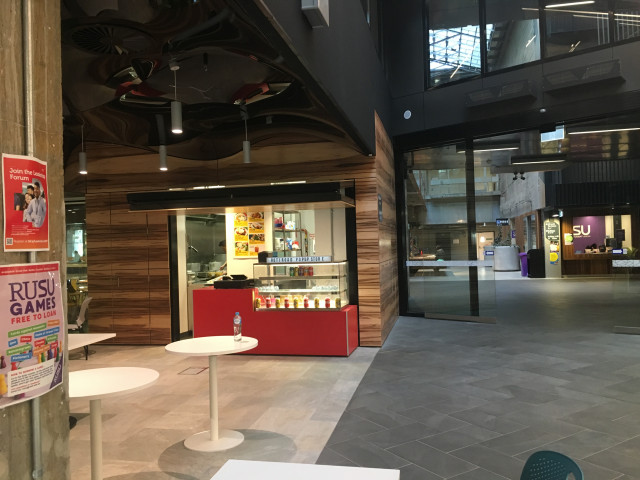 Near the RUSU purple office and through the large sliding door.