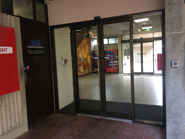 Next to automatic doors