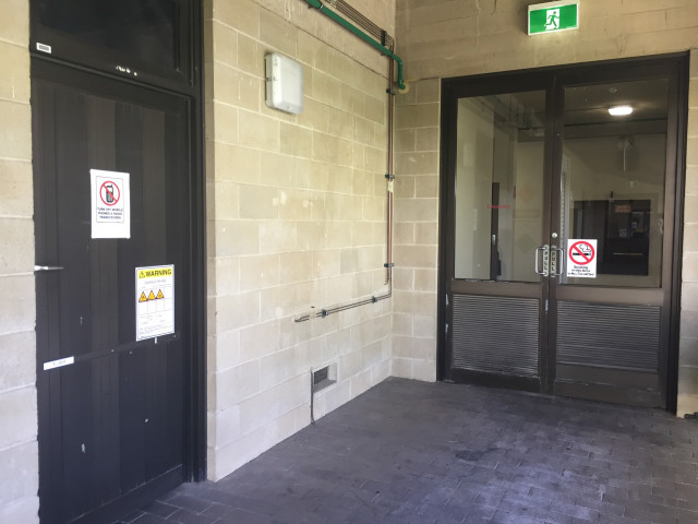 Next to chemistry( south wing) entrance