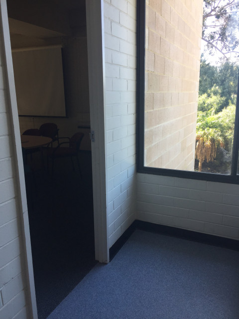 On the left side of the hallway