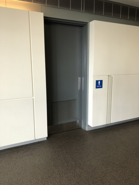 Opposite lecture theatre entrance