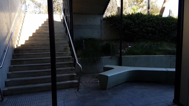 Outdoor study area beside road entry steps.