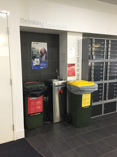 Partially hidden by bins within an alcove.