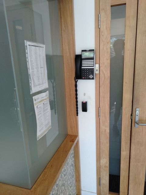 Phone on level 3 next to stairs.