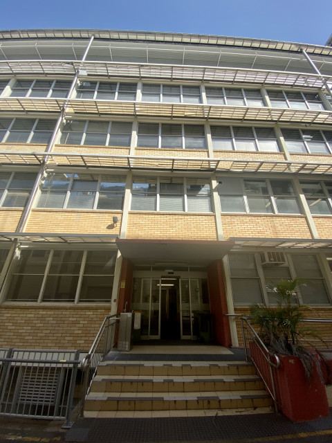 Posterior entry to the building via back alley through Staff House Road