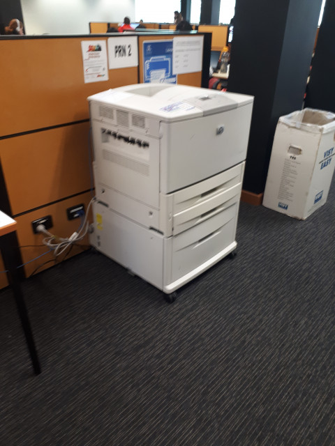 Printer beside the desks