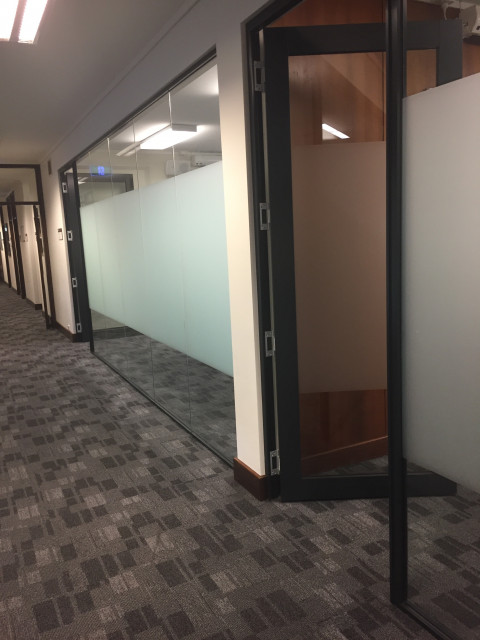 Second door located further down the hall, on the right.