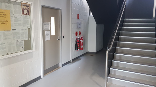 Sleep lab entrance beside west staircase.