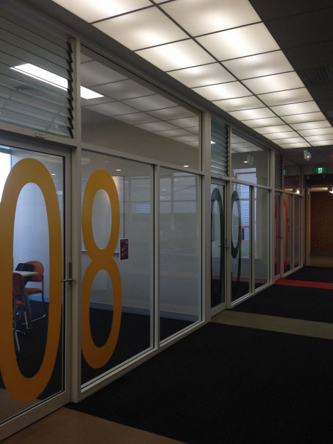Some of the study rooms located within this block of study rooms on the first level of the library