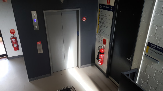SSS115 from staircase showing nearby elevator and courtyard exit