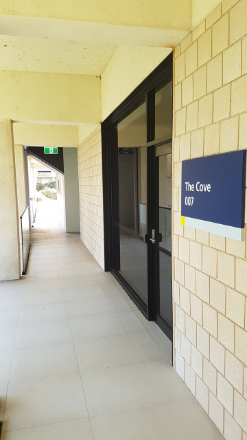 The Cove main entrance on the east side of the building.