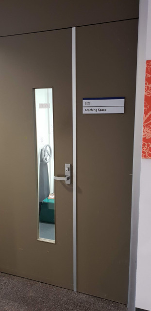 There is a second entrance to room 3.23 via the nearby corridor