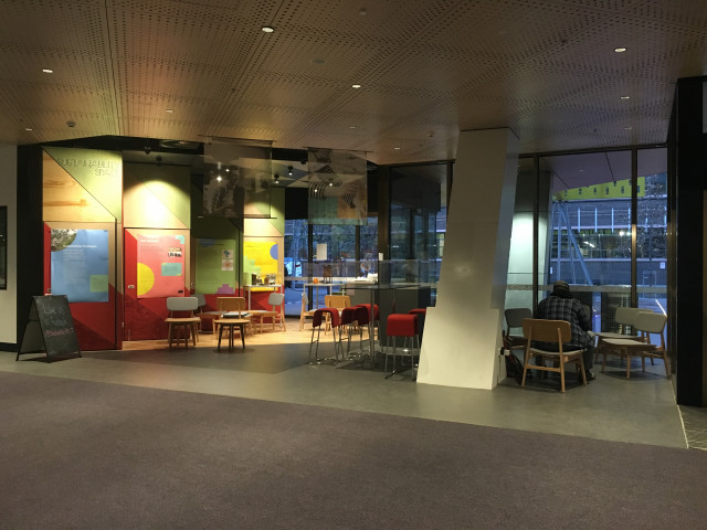 This area is in the corner of the room, next to the doors leading out to Bowen St.
