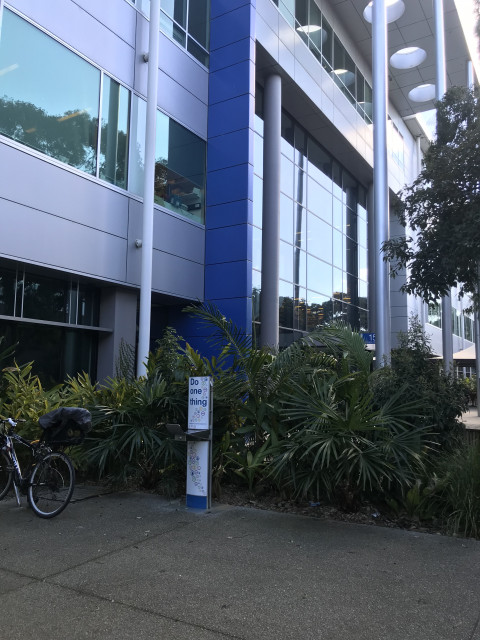 To left of main entrance