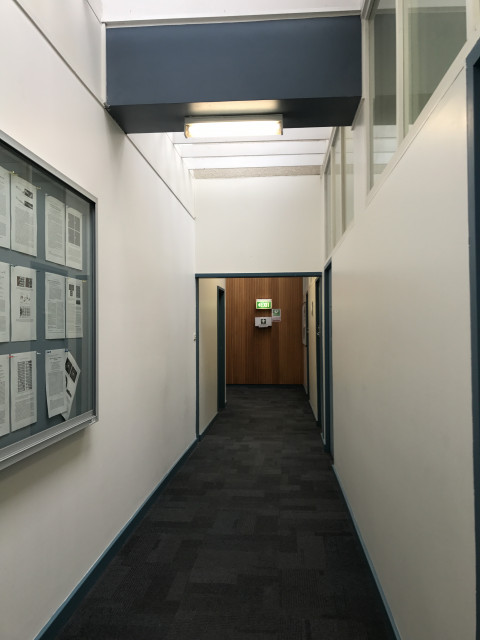 Turn left at end of corridor, printer against wall
