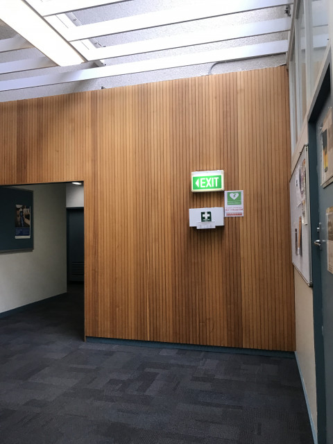 Turn left from end of main corridor