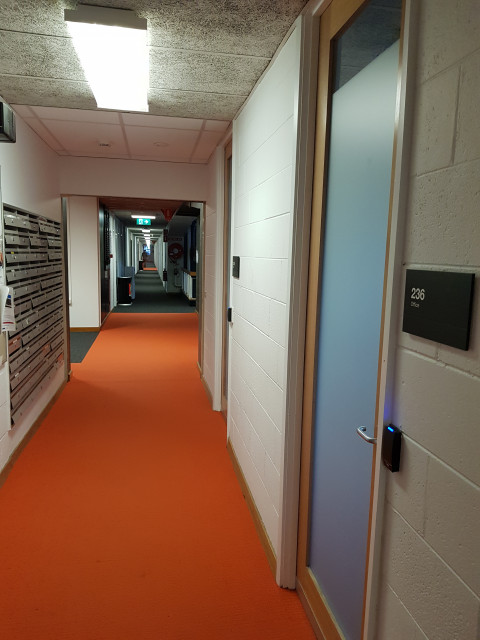 View looking to the stair case. Door on right